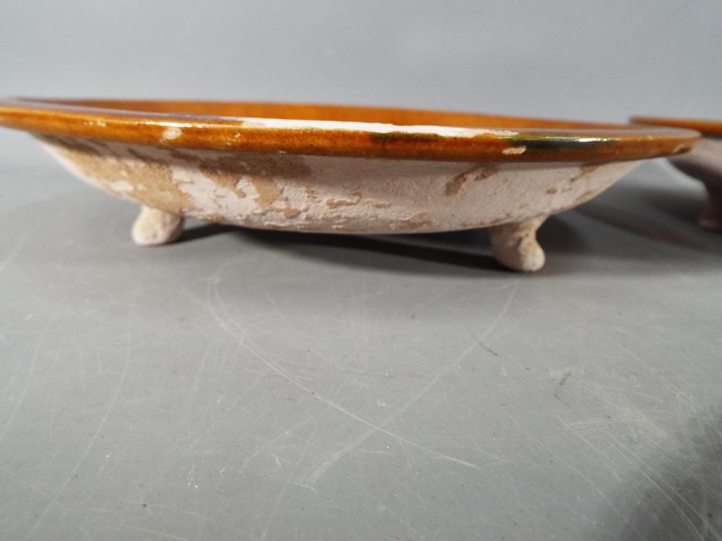 A pair of rare Chinese Tang dynasty sancai glaze terracotta dishes raised on tripod supports with - Image 4 of 6