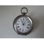 A lady's silver cased, key wind pocket watch stamped .