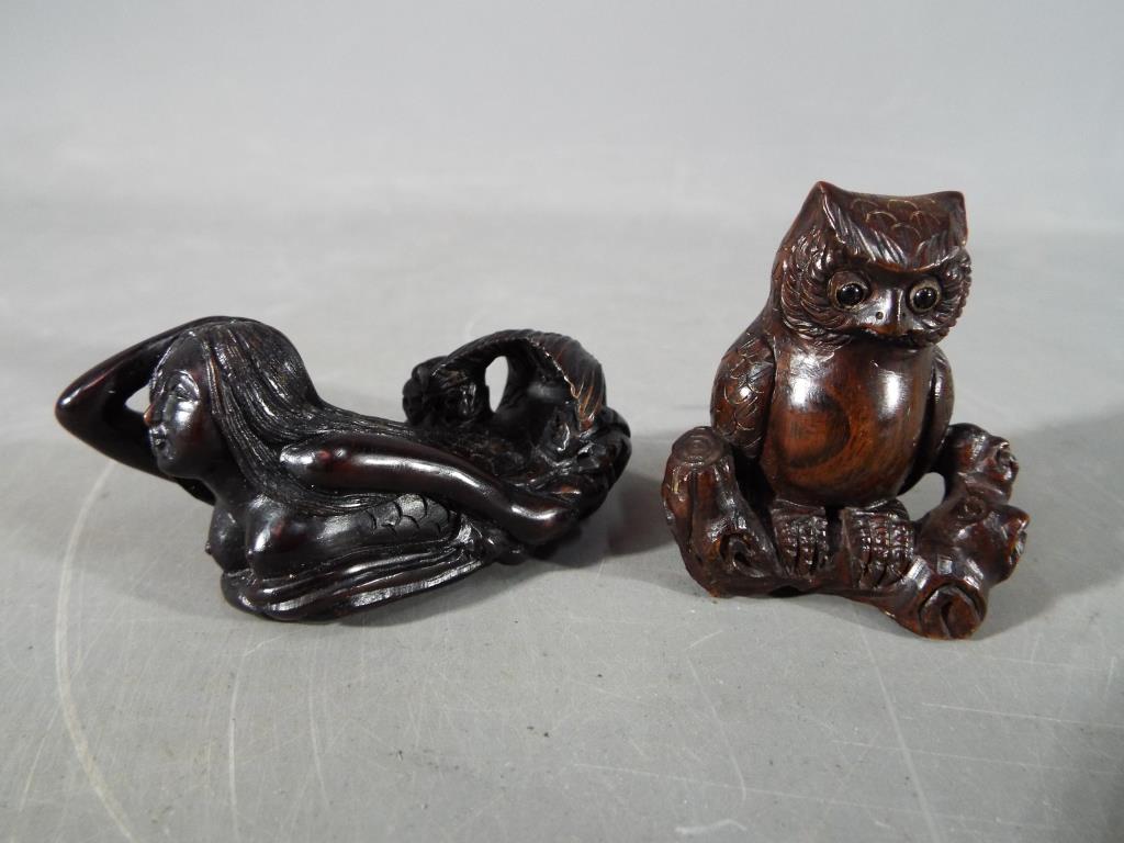 A vintage Japanese dark wood Netsuke depicting an Owl seated on a thick branch or log, - Image 7 of 7