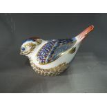 Royal Crown Derby - a paperweight in the form of a Goldcrest with silver coloured stopper