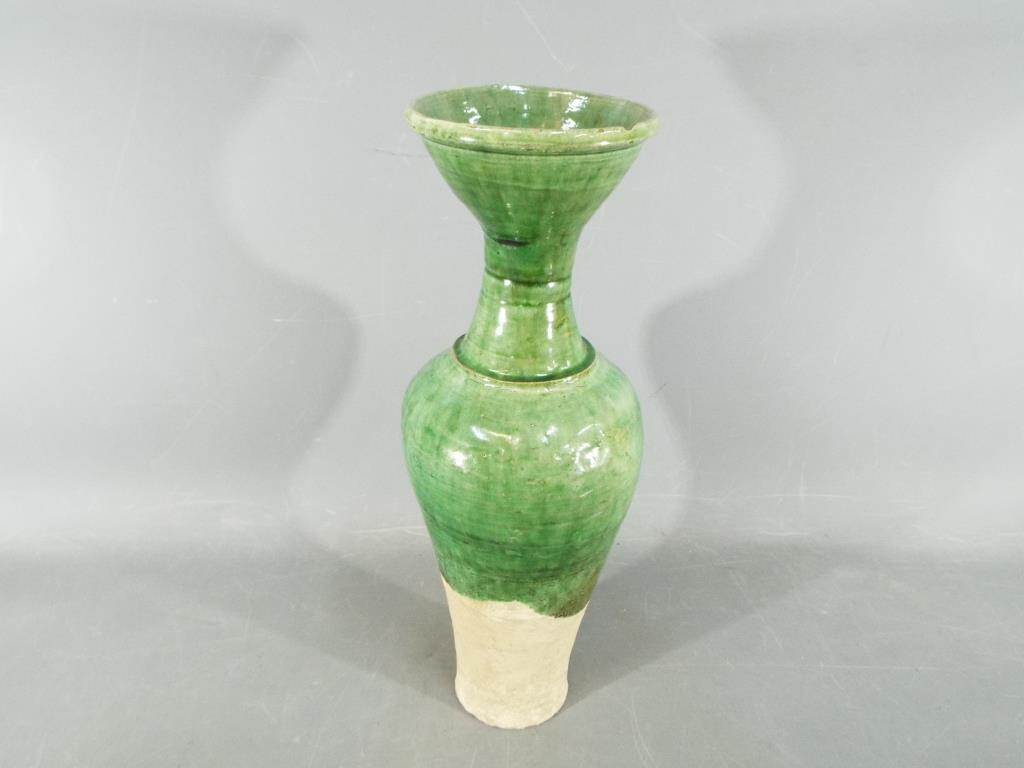 A Chinese Tang dynasty sancai glaze vase of mis-shapen form, unglazed to lower section, - Image 2 of 8