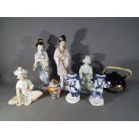 A quantity of ceramics to include figurines, small covered jar and teapot.