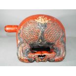 A carved and lacquered monastery bell (mokugyo) and beater,