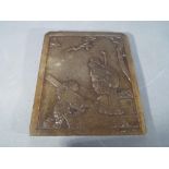 A 19th century Chinese soapstone carved tablet decorated with two gentlemen in a landscape scene,