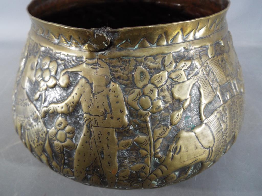 A middle eastern gilt bowl with repoussé decoration depicting fauna and mythical creatures, - Image 5 of 8