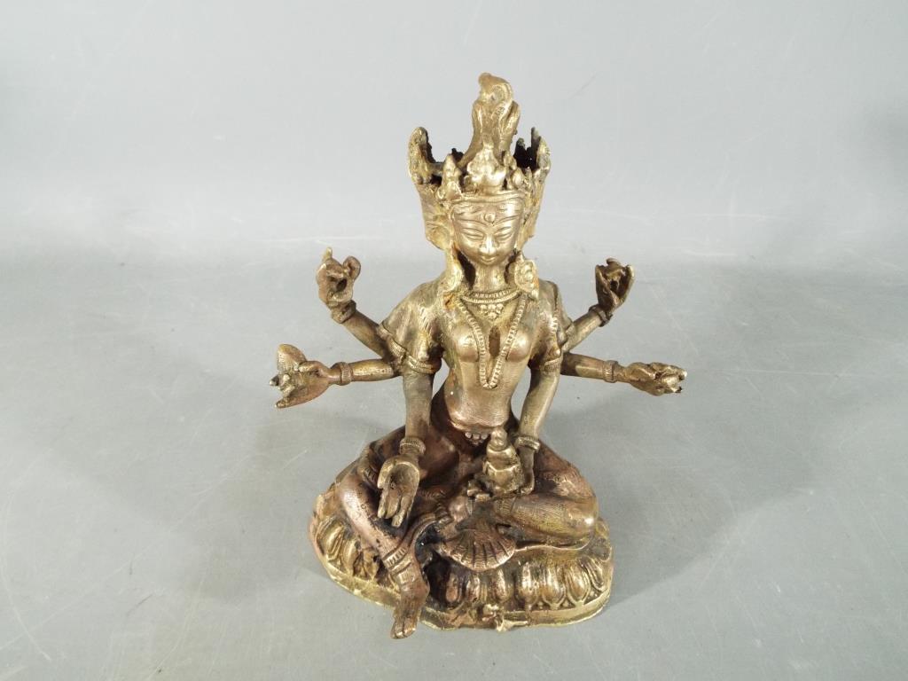 Buddha - A 19th century, Chinese Tibetan, gilt bronze depicting Usnisavijaya in seated pose,