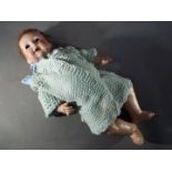 Armand Marseille Doll - a part dressed Armand Marseille doll with jointed arms and legs,