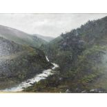 A framed oil on board depicting a landscape scene of a valley,