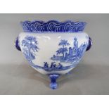 A large blue and white jardiniere marked 'Venetian Flow Blue Staffordshire England',