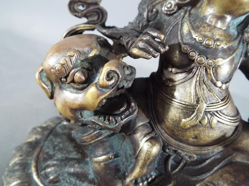 Buddha - An 18th / 19th century Chinese Tibetan gilt bronze Buddhist figure depicting Jambhala - Image 3 of 5