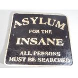 A cast sign marked Asylum