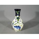 Moorcroft Pottery - a vase decorated in the Chevin Bluebell pattern,