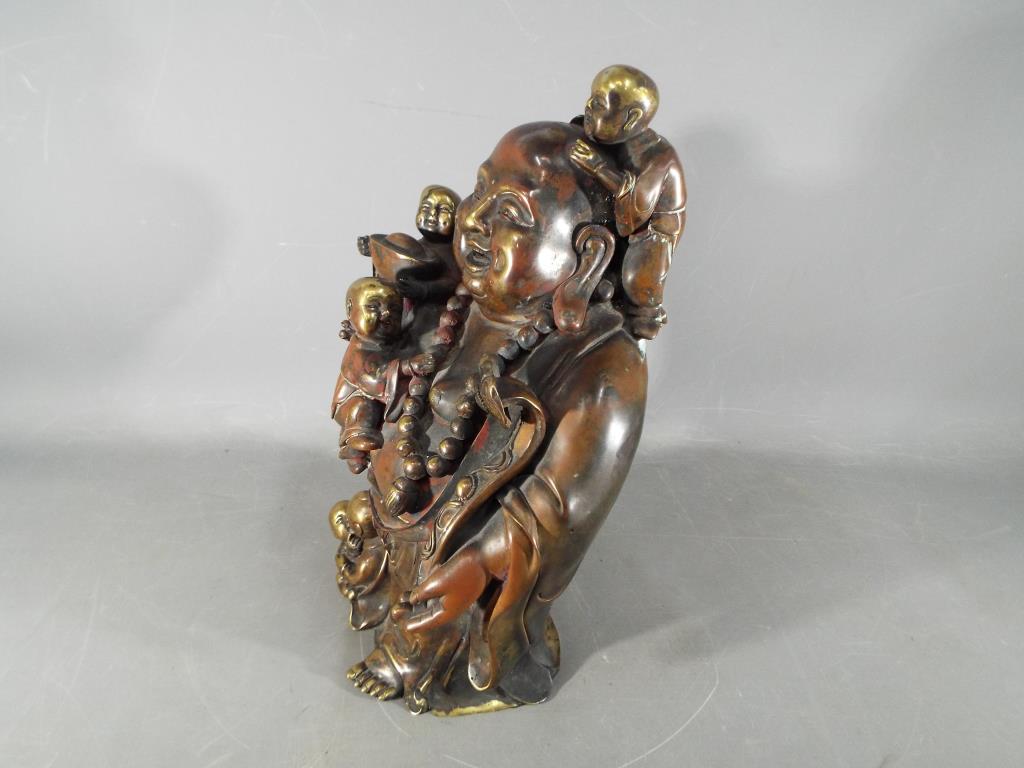 A large Chinese gilt bronze laughing Buddha with five children holding Ruyi sceptre, - Image 7 of 8