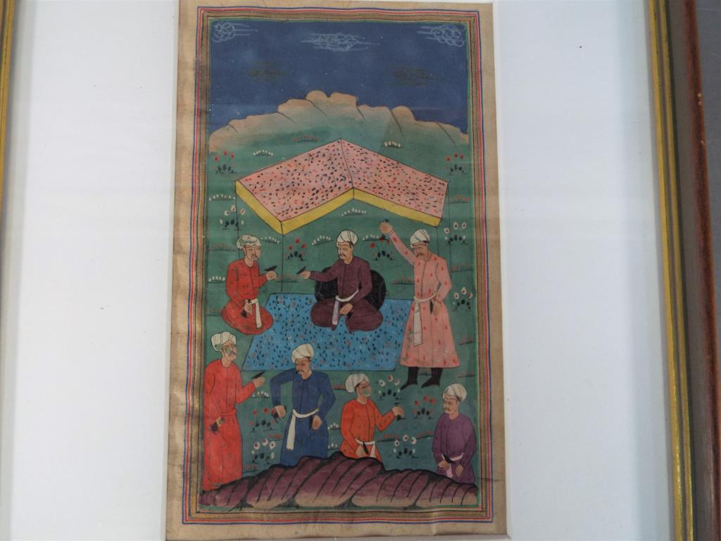 A mounted and framed Safavid Persian style painting depicting an enthroned ruler,