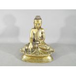 A 19th century Chinese Tibetan bronze seated Shakyamuni depicting Buddha at the moment of