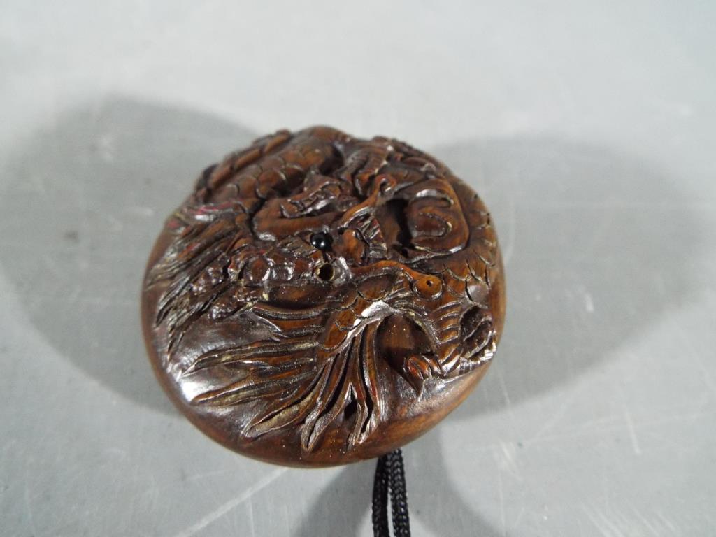 Netsuke - a vintage lacquered Japanese Inro and Netsuke depicting an Oriental person; - Image 2 of 4