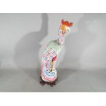 A 19th Chinese famille rose ceramic figurine depicting a Fenghuang (phoenix),