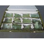 A set of twelve carved celadon jade (dragon is white jade) Chinese zodiac figures, boxed.