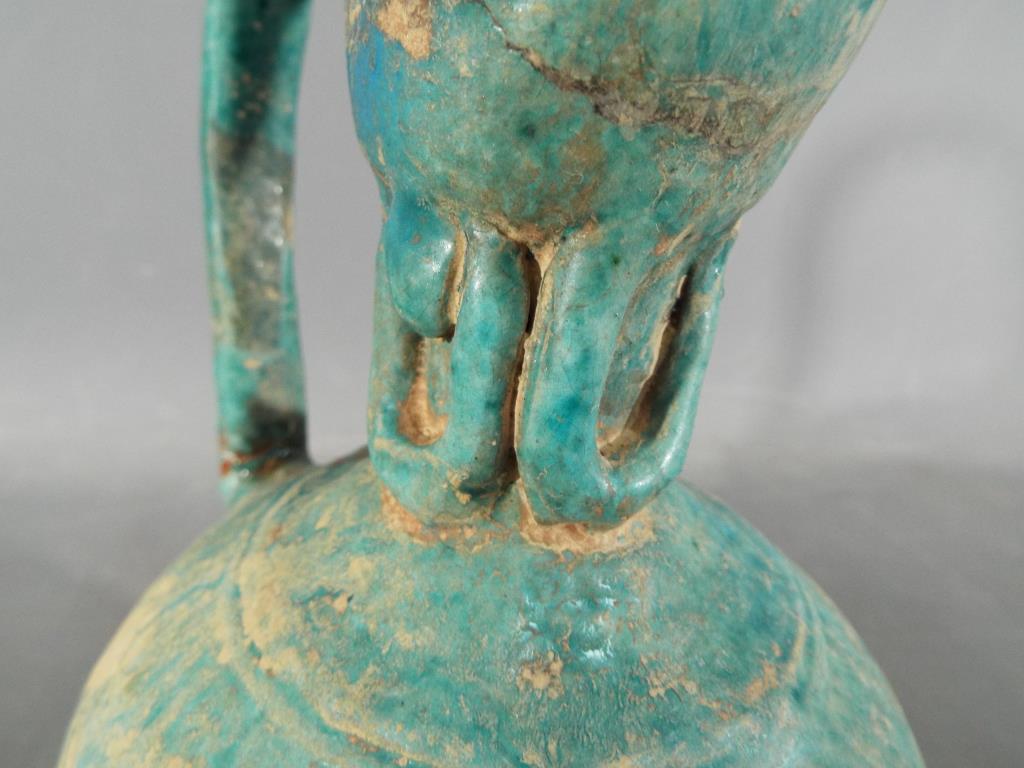 A rare middle eastern turquoise glazed jug of waisted globular form with elongated pouring spout, - Image 6 of 8