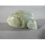 An unusual Chinese jade carving whistle pendant in the form of a carp, approximately 6 cm (l).