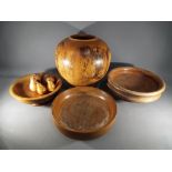 A collection of treen to include large vase, pedestal bowls and similar.