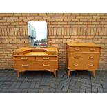 G Plan - Lot to comprise a G Plan chest of three drawers raised on four supports,