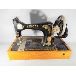 A decorative Singer sewing machine, serial number F9644589.