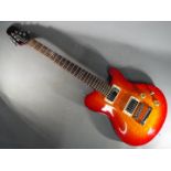 An Indie Shape electric guitar finished in red maple,