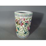 A small Chinese brush pot with scrolling decoration of flowers and insects, ruyi border to the rim,