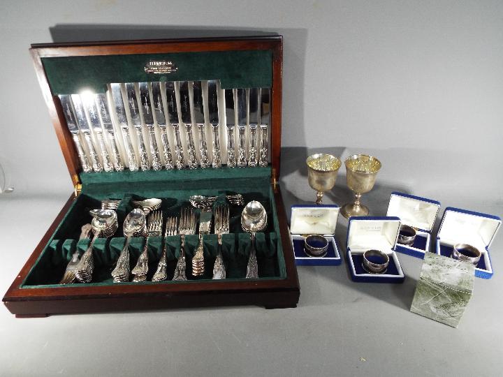 Various plated ware to include an Elkington canteen of cutlery, four cased Aristocrat napkin rings,