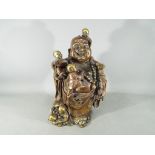 A large Chinese gilt bronze laughing Buddha with five children holding Ruyi sceptre,