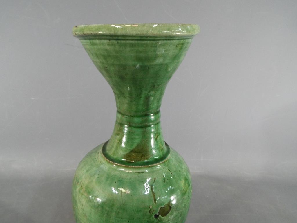 A Chinese Tang dynasty sancai glaze vase of mis-shapen form, unglazed to lower section, - Image 8 of 8