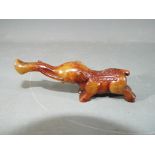 A Chinese russet jade carving of an elephant with five pointed star symbol to the head,