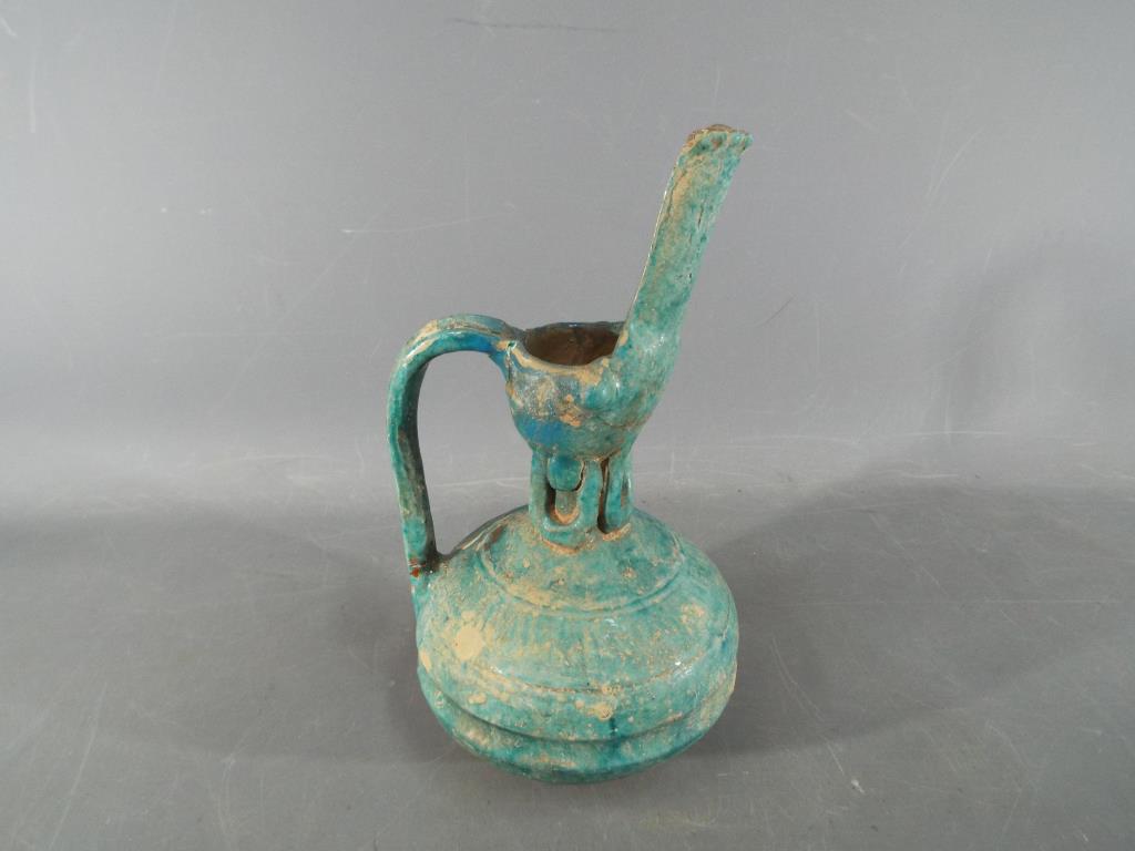 A rare middle eastern turquoise glazed jug of waisted globular form with elongated pouring spout, - Bild 8 aus 8