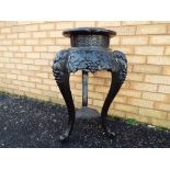 A 19th century Oriental stained wood and marble topped jardiniere stand with circular white marble