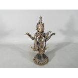 A 19th century bronze model depicting Saraswati playing a Veena, approximately 20.