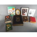 A collection of books to include a family bible, The Complete Works Of Shakespeare,