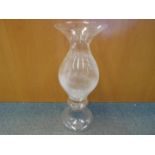 A large floor standing glass vase,