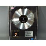 Elvis Presley - A commemorative CD Platinum disc for 'If I Can Dream' with the Royal Philharmonic