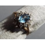 A lady's 9 carat gold ring set with blue stone