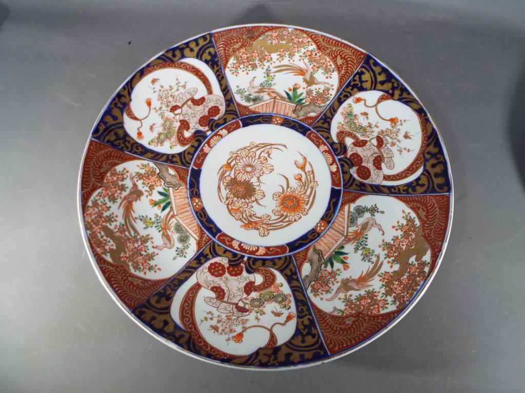 Two Japanese Imari chargers decorated with birds and floral motifs, - Image 6 of 8