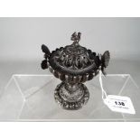 A diminutive bronze centerpiece / vase and cover with twin insect handles,