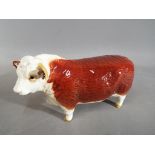 Beswick Pottery - a figurine in the form of a Hereford Bull,