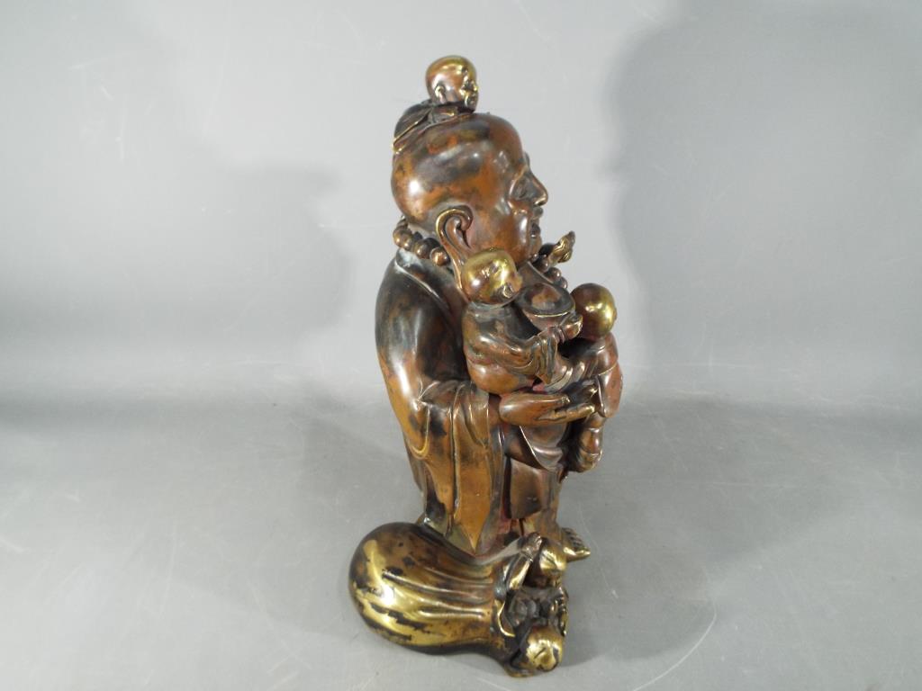 A large Chinese gilt bronze laughing Buddha with five children holding Ruyi sceptre, - Image 5 of 8