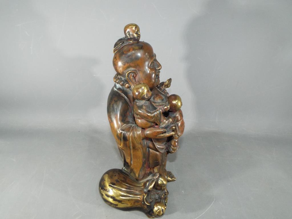 A large Chinese gilt bronze laughing Buddha with five children holding Ruyi sceptre, - Image 4 of 8