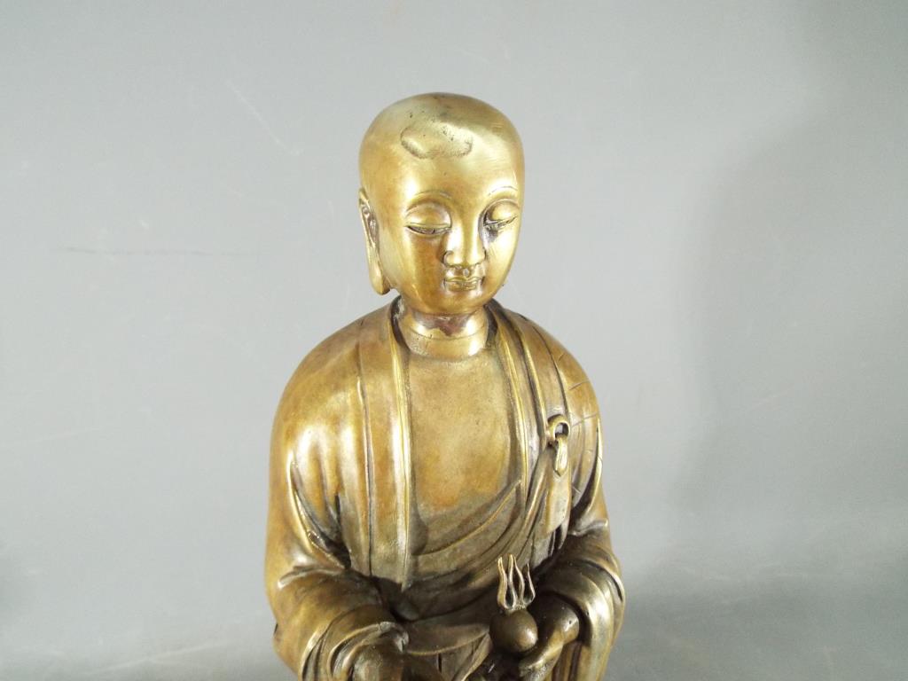 A rare, Chinese Tibetan large gilt bronze depicting Ananda, standing on a lotus base, - Image 2 of 6