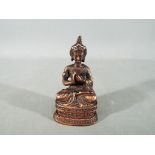 Buddha - A probable 19th century Chinese or Indian copper bronze model depicting a Buddhist deity,