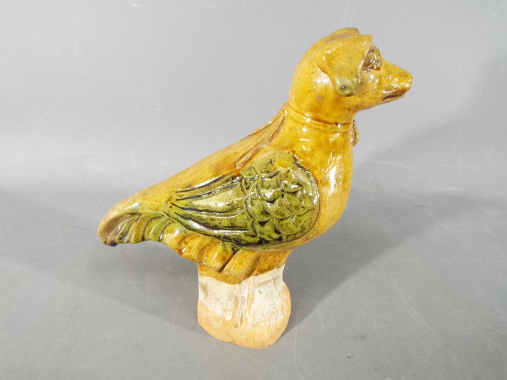 A rare Chinese Tang dynasty, sancai glaze funeral figure depicting a bird with a canine head. - Image 3 of 6