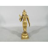 A good quality 19th century gilt bronze depicting Parvati in standing pose holding flower,