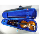 A Stentor Student 1, 3/4 size violin with bow in padded case.